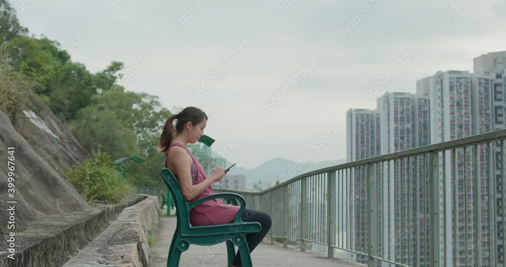 Sport woman use of smart phone to record hiking trail Sport woman use of smart phone to record hiking trail