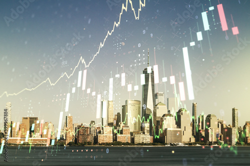 Abstract virtual financial graph hologram on New York cityscape background, financial and trading concept. Multiexposure