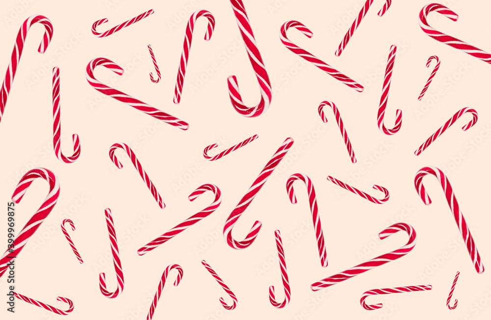 Pattern of candy canes on background of set sail champagne of color, 2021 trend. Pattern of candy canes on background of set sail champagne of color, 2021 trend.