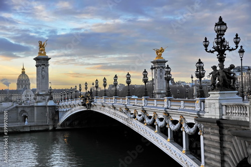 View to Alexander III bridgeto and Invalides church in Paris, France 
