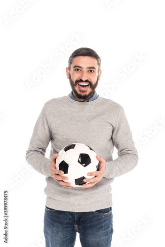 excited hispanic man holding soccer ball isolated on white