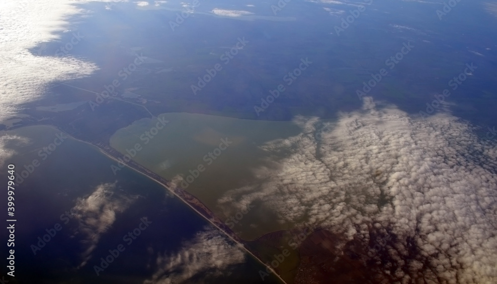 Estuary of the Black Sea. Odessa Region. Bird eye view from airplane window. Clouds panorama from airplane. Flight from Kiev to Sharm El Sheikh, Egypt.