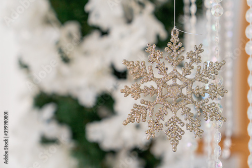 Green Christmas tree with white flowers