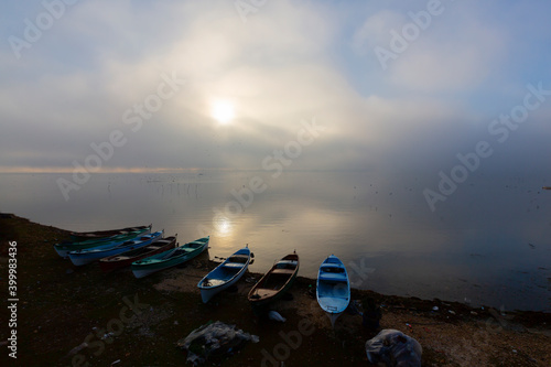 Beautiful sunset landscape at Gölyazı (Golyazi) on Lake Ulubat. with golden sun and tree, Bursa, Turkey. photo