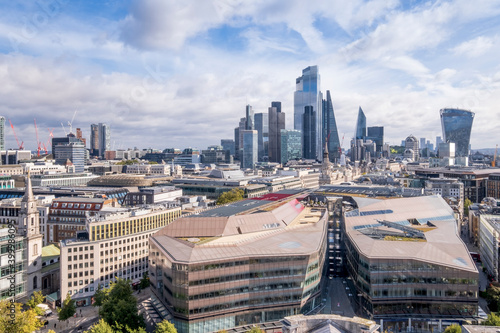 The skyscrapers of the City of London business and financial district with the One New Change shopping centre in the foreground, London, England photo