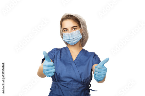Female hand of a surgeon in a blue medical glove shows a thumbs up sign isolated on a white background