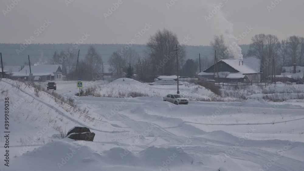 In the village in winter, in the frost, at each courtyard, stoves are heated and smoke rises into the cold sky. In the village in winter, in the frost, at each courtyard, stoves are heated and smoke rises into the cold sky.