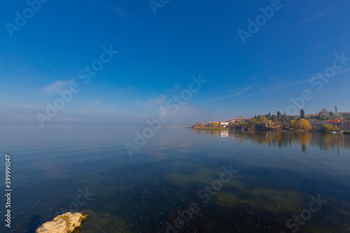 Beautiful sunset landscape at Gölyazı (Golyazi) on Lake Ulubat. with golden sun and tree, Bursa, Turkey. photo