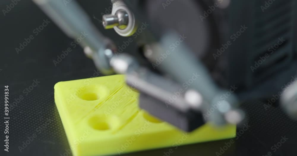 3D Printing Machine printing a piece of plastic 3D Printing Machine printing a piece of plastic