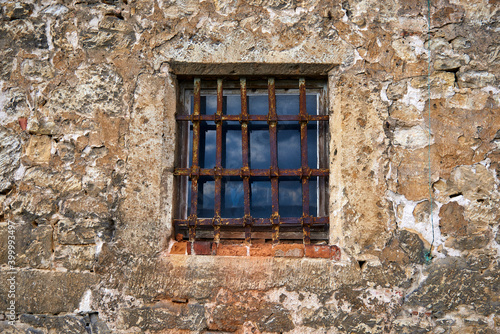 An old window in the castle with a rusty steel grate © Tschernawzew Andre