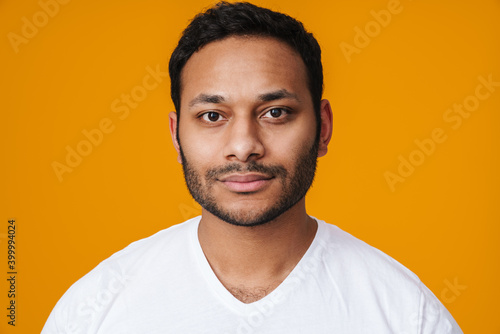 Asian confident unshaven man posing and looking at camera
