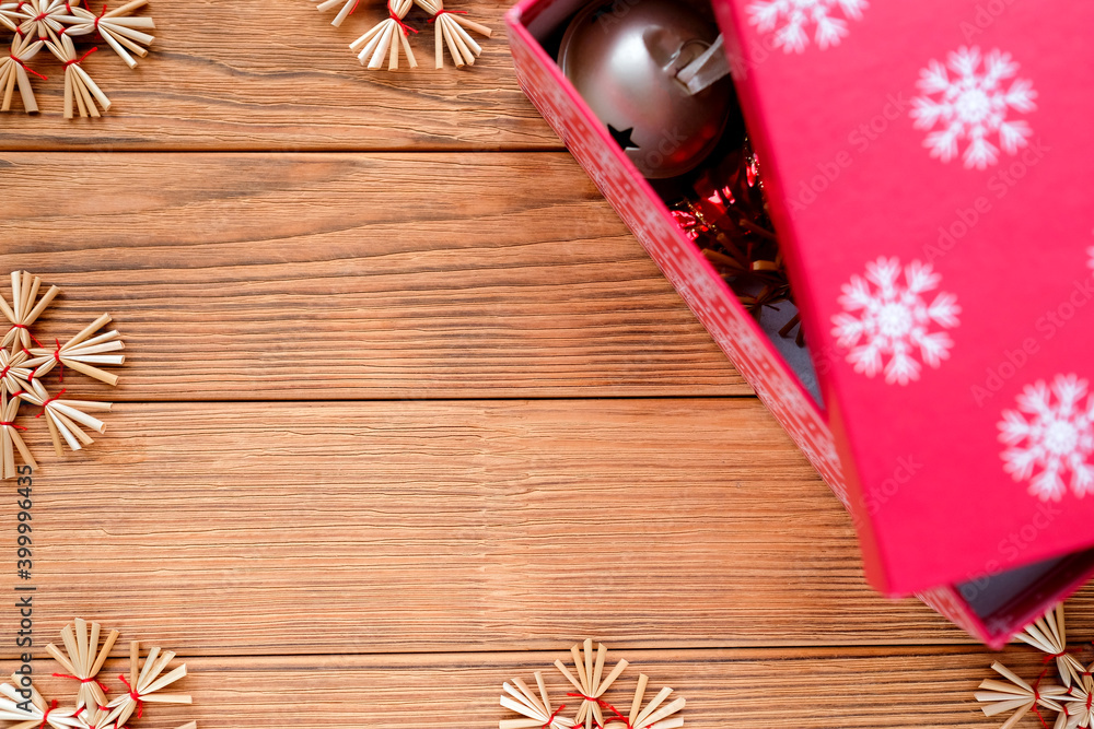 Festive card with place for text. Red box, straw snowflakes Festive card with place for text. Red box, straw snowflakes