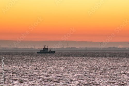 a ship on the sea at sunrise © Ingo