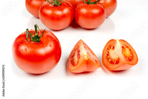 red tomatoes whole and cut into wedges