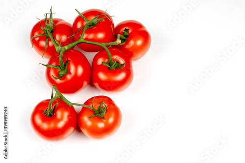 branch of bright red tomato on a white background © Вячеслав 