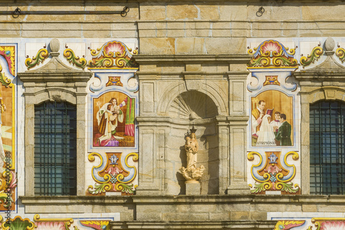  facade covered with azulejos of the Nossa Senhora do Amparo Church located in Valega, district of Aveiro, Portugal photo