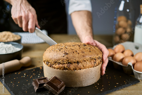 Healthy and nutritious breakfast with a slice of homemade cereal bread, milk and nuts. The dessert was made with flour, eggs, cereals, oats, spelled, barley and chocolate.