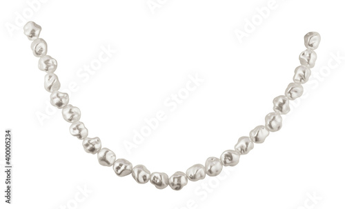 Closeup of sagging string of baroque pearls isolated on white