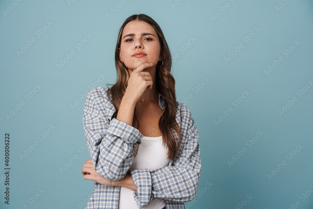 Serious beautiful nice girl posing and looking at camera Serious beautiful nice girl posing and looking at camera