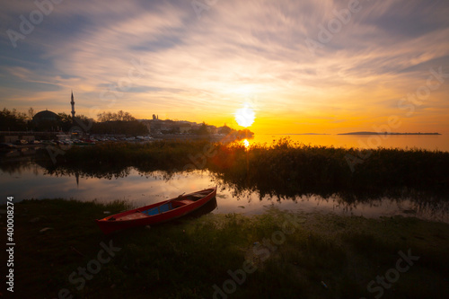 Beautiful sunset landscape at Gölyazı (Golyazi) on Lake Ulubat. with golden sun and tree, Bursa, Turkey. photo