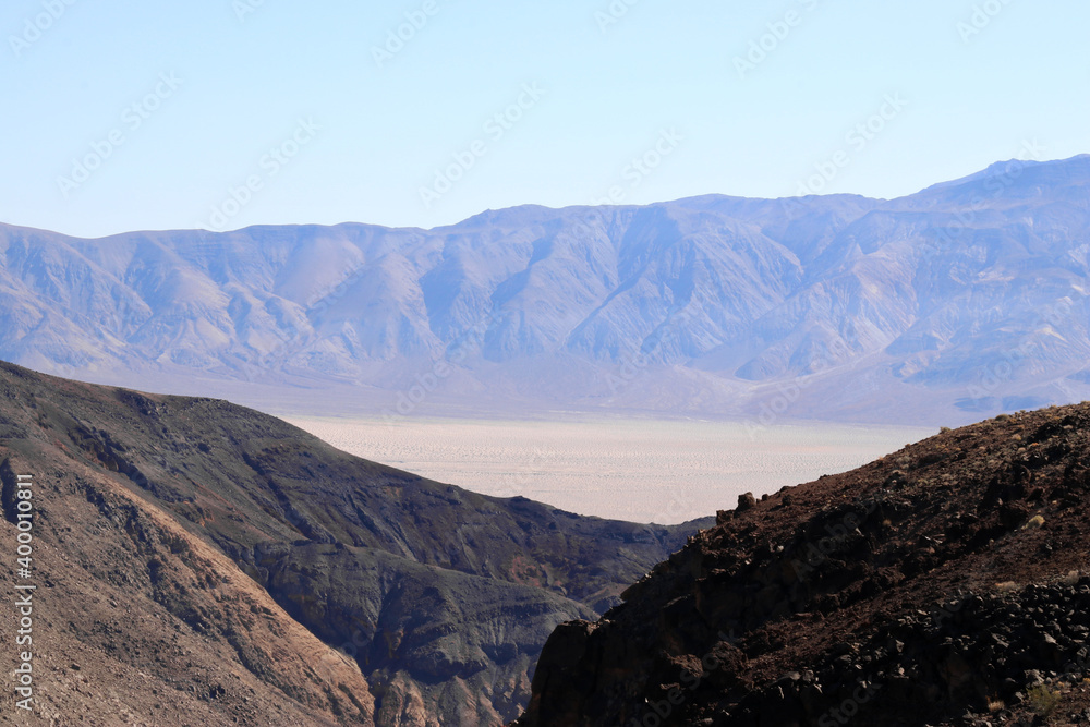 view of Death valley with mountains in the background and foreground and the desert in the middle