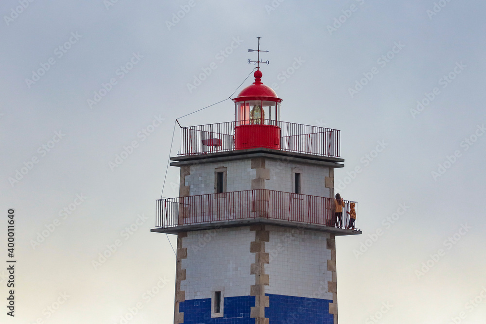 Lighthouse tower at the sunset. Santa Marta Lighthouse in Cascais, Portugal	