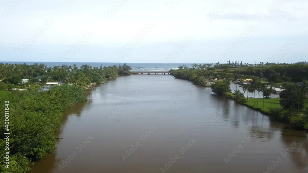 Aerial view along river approaching estuary and sea, Kauai, Hawaii Aerial view along river approaching estuary and sea, Kauai, Hawaii