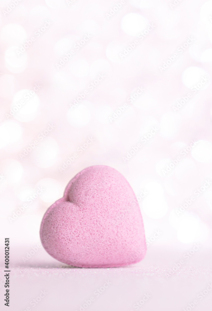 Obraz premium Valentines day greeting card , pastel pink heart on gentle pink background with bokeh and place for text .Vertical.