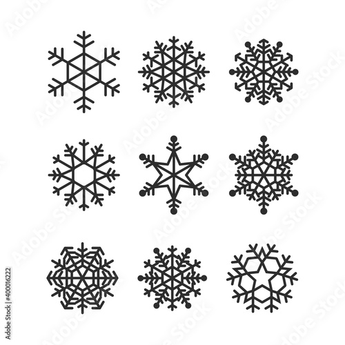 Fototapeta Naklejka Na Ścianę i Meble -  Set of simple geometric black snowflakes isolated on white background. Vector holiday christmas collection