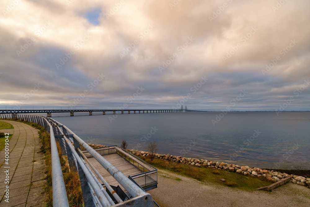 The Sound Bridge, the bridge and underwater tunnel connecting Malmo, Sweden with Copenhagen, Denmark. Beautiful sunset sky in the background