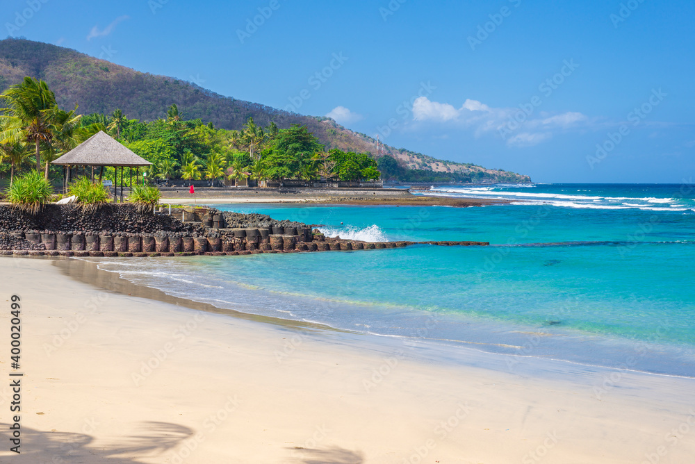 Tropical beach in Candidasa town on Bali island in Indonesia
