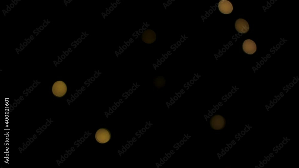 Blurred Christmas lights that twinkle brightly creating a New Year's mood.