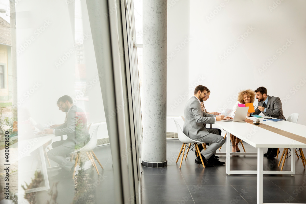 Multiethnic business people working together in the office Multiethnic business people working together in the office