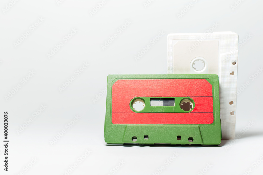 Close-up of two vintage music cassette on white background.