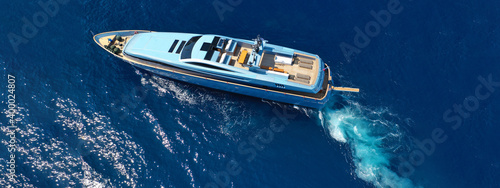 Aerial drone top down ultra wide photo of luxury yacht cruising in low speed in Mediterranean deep blue sea © aerial-drone