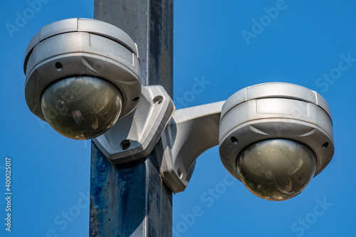 360 Degree fish eye dome CCTV is installed on column against blue sky. CCTV for security monitoring