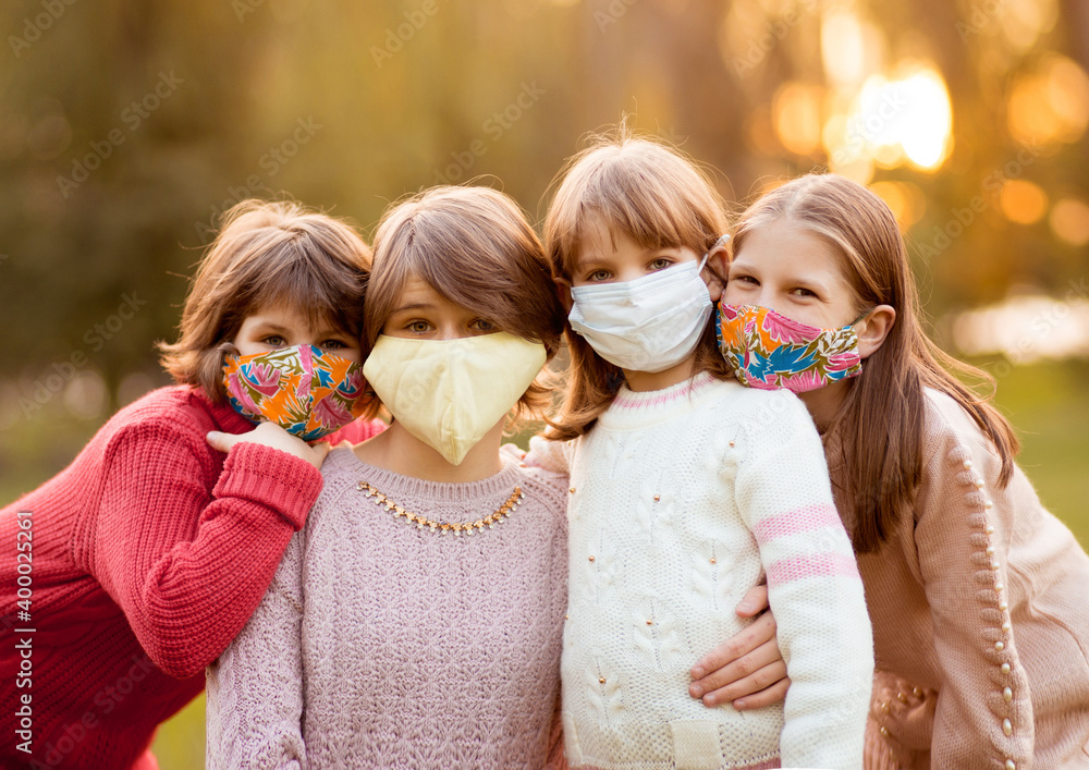 Portrait of happy friends children smiling in protective face masks Portrait of happy friends children smiling in protective face masks