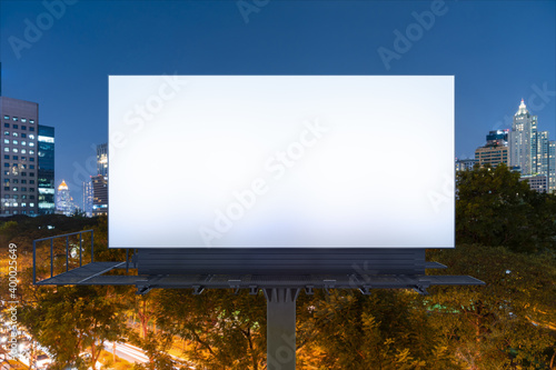 Photography Blank white road billboard with Bangkok cityscape background at night time