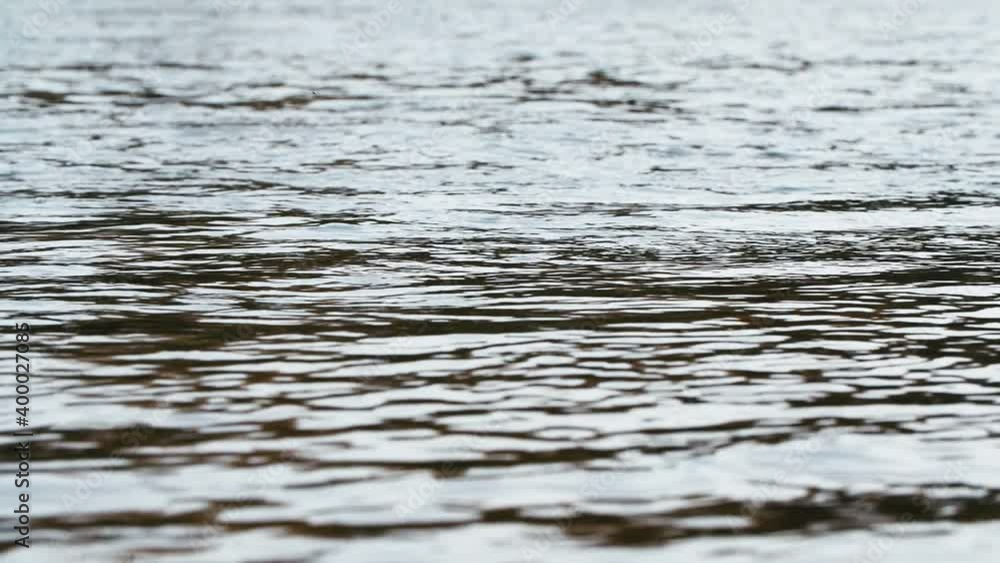 Surface water background in the river. Low angle shot, slow motion. Surface water background in the river. Low angle shot, slow motion.