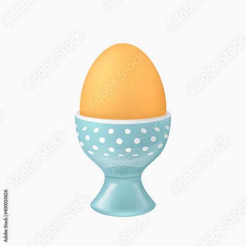 brown egg in blue eggcup on white