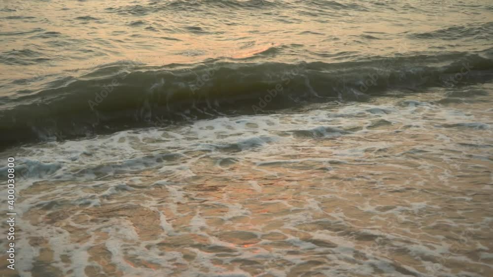 Beautiful sunset on the sea with rolling waves Beautiful sunset on the sea with rolling waves