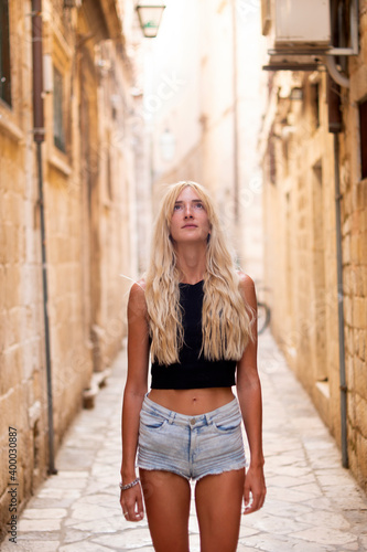 Young sexy tourist woman in the old town