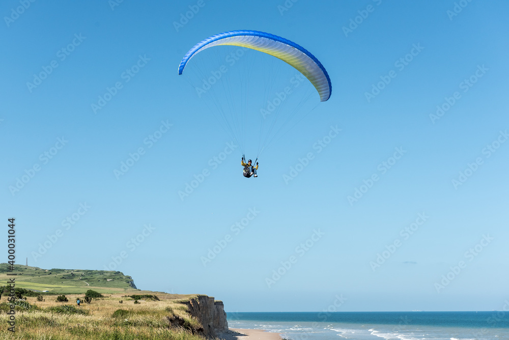 Paragliding above the cliff in northern France Paragliding above the cliff in northern France