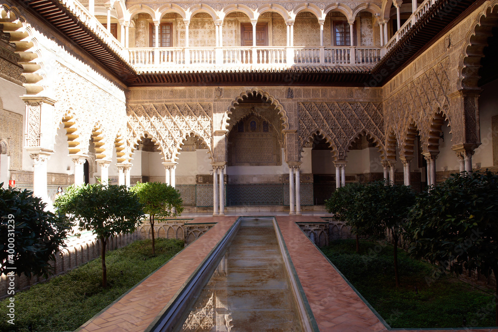 Fototapeta premium Seville (Spain). Pond in the Patio de las Doncellas in the Real Alcázar of Seville