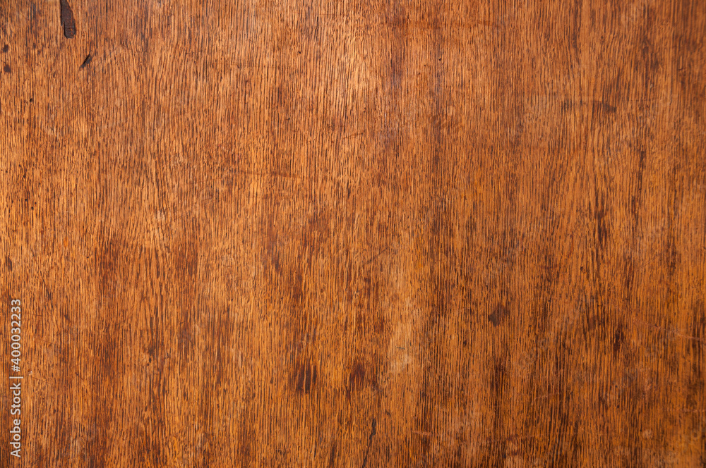 Brown old and scratched wooden table texture for background Brown old and scratched wooden table texture for background