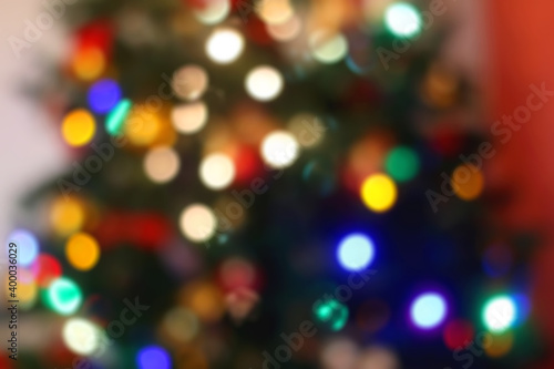 Colorful Christmas tree bokeh. Defocused Christmas background. 