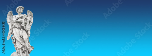 Photography Banner with statue of beautiful holy angel with wings at the Saint Angel bridge, isolated at blue sky background and copy space, Rome, Italy