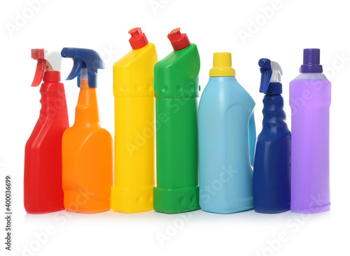Bottles of different cleaning products on white background