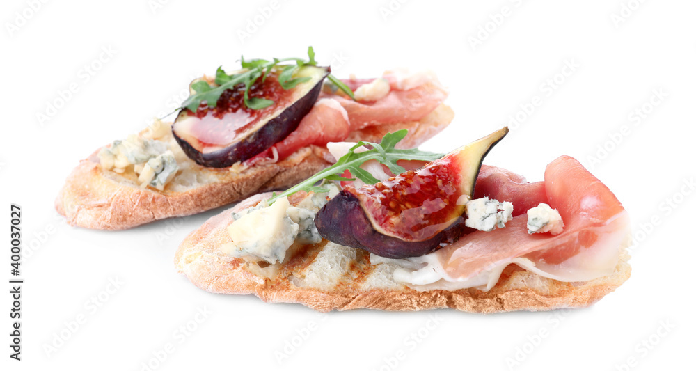 Sandwiches with ripe figs and prosciutto on white background