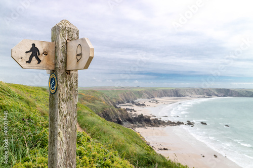 Wales Coast Path sign on clifftops above Marloes Sands, Pembrokeshire photo